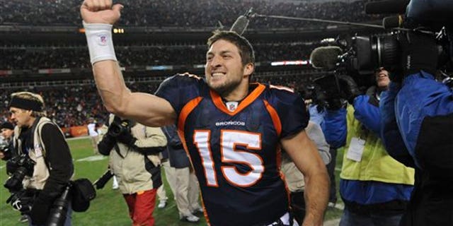 Broncos quarterback Tim Tebow celebrates after beating the Pittsburgh Steelers 29-23 in overtime in the wild card playoff game in Denver on Jan. 8, 2012.