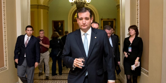 FILE - In this Oct. 16, 2013, file photo, Tea party conservative Sen. Ted Cruz, R-Texas, walks to a meeting as the Senate prepares to vote on a measure to avert a threatened Treasury default and reopen the government after a partial, 16-day shutdown, at the Capitol in Washington. Cruz took nothing short of a victory lap in his state of Texas this week, appearing before crowds that overlooked the fact that the Republican who led the charge to kill money for President Barack Obamaâs health care law had failed. Now heâs coming to Iowa, where Republicans have the first say in the presidential race, and will view him much more skeptically.  (AP Photo/J. Scott Applewhite, File)