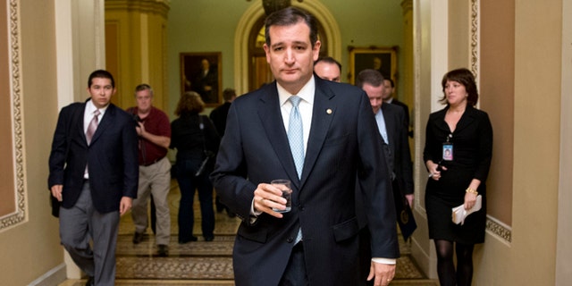 FILE - In this Oct. 16, 2013, file photo, Tea party conservative Sen. Ted Cruz, R-Texas, walks to a meeting as the Senate prepares to vote on a measure to avert a threatened Treasury default and reopen the government after a partial, 16-day shutdown, at the Capitol in Washington. Cruz took nothing short of a victory lap in his state of Texas this week, appearing before crowds that overlooked the fact that the Republican who led the charge to kill money for President Barack Obamaâs health care law had failed. Now heâs coming to Iowa, where Republicans have the first say in the presidential race, and will view him much more skeptically. (AP Photo/J. Scott Applewhite, File)