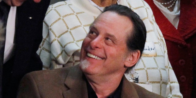 This Feb. 12, 2013 file photo shows musician Ted Nugent, guest of Rep. Steve Stockman, R-Texas, before the State of the Union address by President Barack Obama on Capitol Hill in Washington.