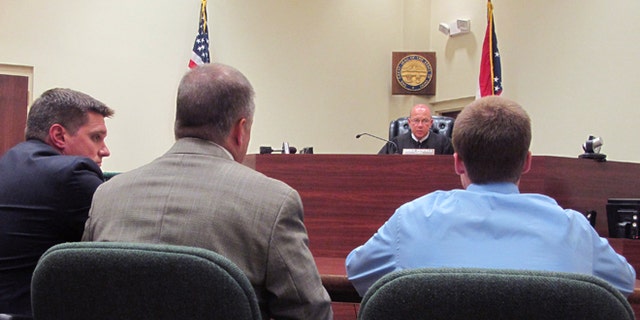 July 31, 2012: In this photo, Warren County Juvenile Court Judge Mike Powell warns 17-year-old Ohio high school student Tyler Pagenstecher, right, of the consequences of admitting guilt at his first hearing in Lebanon, Ohio.