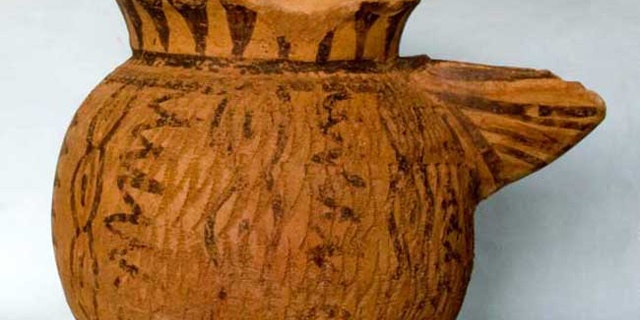 This strainer-spouted pitcher is from the Halaf period and dates from about 5400 B.C. It is painted and impressed in a pattern of connected ovals that is a common motif in the Halaf culture, and was found in the newly discovered prehistoric town of Tell Zeidan, near modern-day Syria.