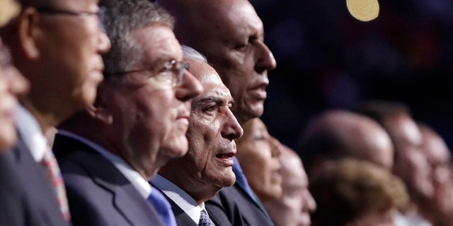 Brazil interim President Michel Temer, third from left, sings the Brazilian national anthem during the opening ceremony for the 2016 Summer Olympics in Rio de Janeiro, Brazil, Friday, Aug. 5, 2016. (AP Photo/Mark Humphrey, Pool)