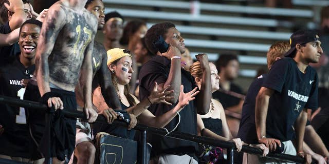 Vanderbilt fans react to a dropped pass in the fourth quarter of an NCAA college football game Friday, Aug. 29, 2014, in Nashville, Tenn. (AP Photo/Brian Powers)