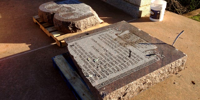 Oct. 24, 2014: The damaged remains of a Ten Commandments monument are gathered on the Oklahoma State Capitol grounds in Oklahoma City. (AP/Sean Murphy)