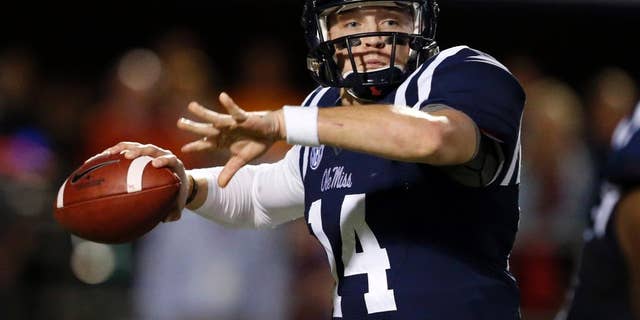 Mississippi quarterback Bo Wallace readies to pass against Tennessee in the second half of an NCAA college football game in Oxford, Miss., Saturday, Oct. 18, 2014. No. 3 Mississippi won 34-3. (AP Photo/Rogelio V. Solis)