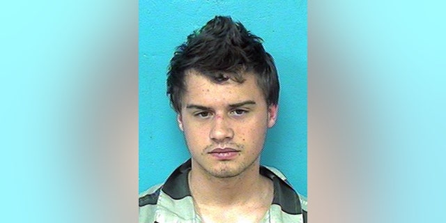 This photo provided by the Sullivan County Sheriff’s Office shows Robert Seth Denton. Outfitted in camouflage and armed with a high-powered rifle and 100 rounds of ammunition, Denton fatally shot his mother, step-father and grandmother while six children witnessed the carnage in the family's double-wide mobile home in eastern Tennessee, a sheriff said Monday, Aug. 31, 2015. (Sullivan County Sheriff via AP)