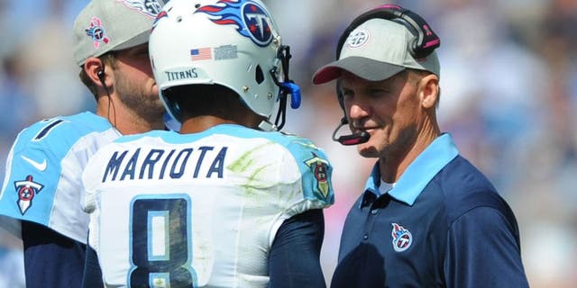 Oct 11, 2015; Nashville, TN, USA; Tennessee Titans quarterback Marcus Mariota (8) talks with head coach Ken Whisenhunt during the first half against the Buffalo Bills at Nissan Stadium. Mandatory Credit: Christopher Hanewinckel-USA TODAY Sports