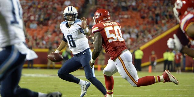 Aug 28, 2015; Kansas City, MO, USA; Tennessee Titans quarterback Marcus Mariota (8) is pressured by Kansas City Chiefs outside linebacker Justin Houston (50) in the first half at Arrowhead Stadium. Mandatory Credit: John Rieger-USA TODAY Sports