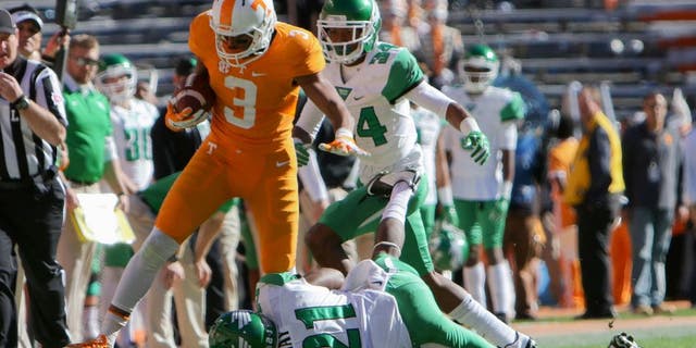Nov 14, 2015; Knoxville, TN, USA; Tennessee Volunteers wide receiver Josh Malone (3) runs the ball against North Texas Mean Green defensive back James Gray (21) during the first half at Neyland Stadium. Mandatory Credit: Randy Sartin-USA TODAY Sports