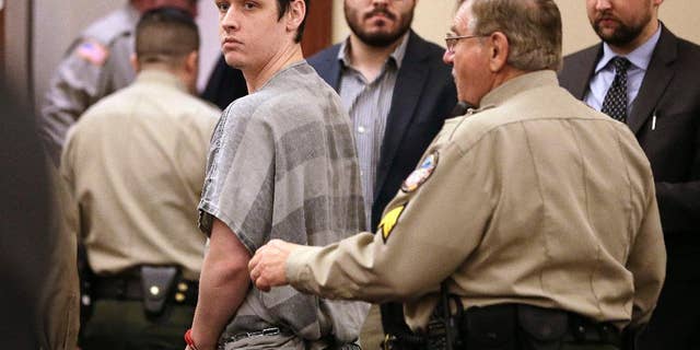 John Dylan Adams escorted out of a courtroom in December 2014.