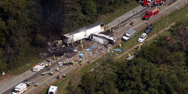 Oct. 2, 2013: In this aerial photo, emergency workers respond to a crash involving a church bus and a tractor-trailer near Dandridge, Tenn.