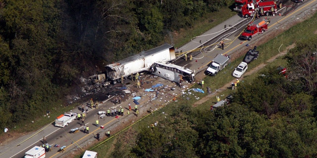 Oct. 2, 2013: In this aerial photo, emergency workers respond to a crash involving a church bus and a tractor-trailer near Dandridge, Tenn.