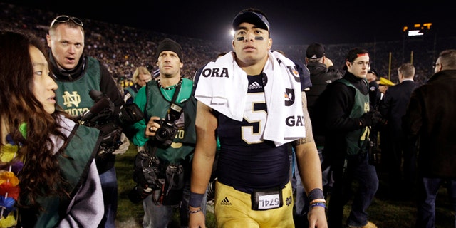 Nov. 17, 2012: In this file photo, Notre Dame linebacker Manti Te'o walks off the field following an NCAA college football game against Wake Forest in South Bend, Ind.