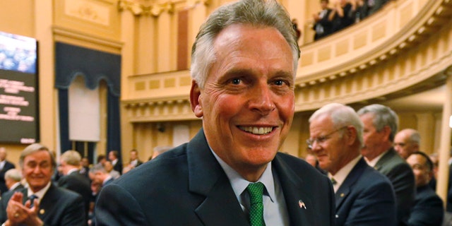 In this Wednesday, Jan. 14, 2015 photo Virginia Gov. Terry McAuliffe leaves the chambers after delivering his annual State of the Commonwealth address at the Capitol in Richmond, Va.