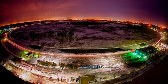 The 4-mile in circumference Tevatron accelerator uses superconducting magnets chilled to minus 450 degrees Fahrenheit, as cold as outer space, to move particles at nearly the speed of light.