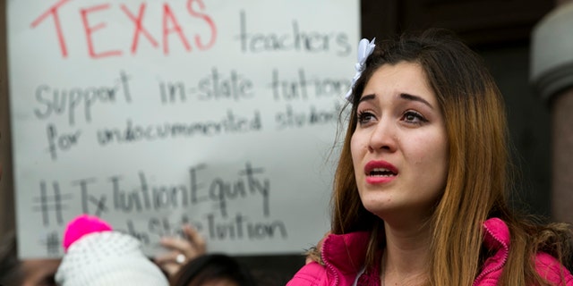 Nahiely Garcia, 19, of Edinburg, cries as she speaks in support of the HB1403, the Texas DREAM Act, at a demonstration at the Capitol in Austin, Texas, on Wednesday January 14, 2015. More 50 people, a coalition of businesses, affected students, supporters, and lawmakers, rallied to preserve the 2001 in-state tuition law. (AP Photo/Austin American-Statesman, Jay Janner)
