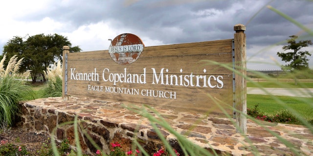 A sign marks the entrance of the Kenneth Copeland Ministries Eagle Mountain Church, Tuesday, Aug. 27, 2013, in Newark, Texas.