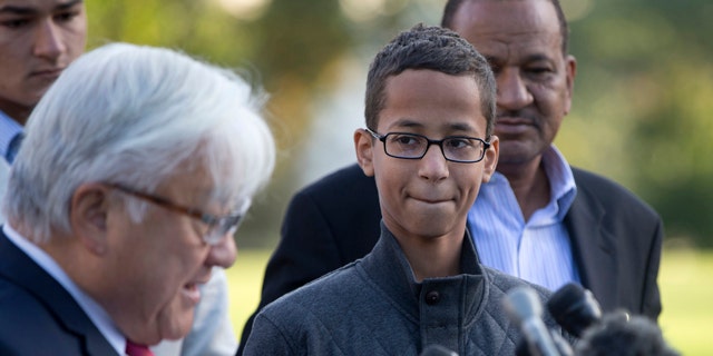 Ahmed Mohamed, second from right, listens as Rep. Mike Honda, D-Calif., left, speaks during a news conference on Capitol Hill in Washington. (AP Photo/Carolyn Kaster)
