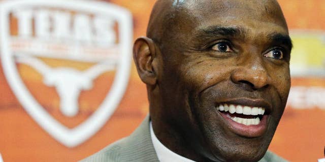 FILE - In this Jan. 6, 2014 file photo, Charlie Strong answers questions during a news conference where he was introduced as the new Texas football coach in Austin, Texas. For the first time since 1997, the Texas Longhorns will suit up for a game without Mack Brown on the sideline. (AP Photo/Eric Gay)