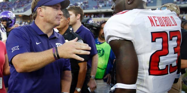 TCU head coach Gary Patterson talks with Texas Tech defensive back La'Darius Newbold (23) following their NCAA college football game, Saturday, Oct. 25, 2014, in Fort Worth, Texas. TCU won 82-27. (AP Photo/Tony Gutierrez)