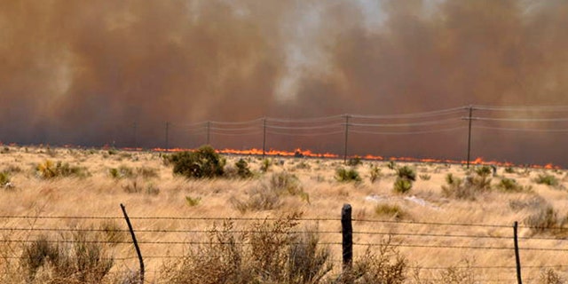 April 10, 2011: An uncontrolled wildfire burns at the Jeff Davis and Presidio County line near Fort Davis, Texas. A fast-moving wildfire had spread to more than 60,000 acres in Presidio County and Jeff Davis County, where it destroyed about 20 homes in Fort Davis.
