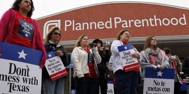 March 11, 2012: Local citizens and employees of the Planned Parenthood clinic in San Angelo, Texas, gather to participate in the "Don't Mess with Texas Women" rally.