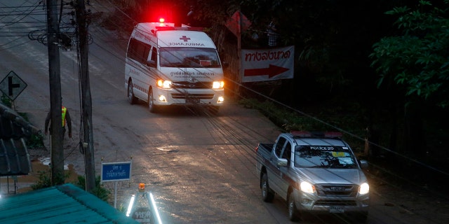 One of two ambulances leave the cave in northern Thailand hours after operation began to rescue the trapped youth soccer players and their coach.
