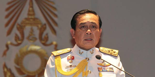 FILE - In this Monday, May 26, 2014 file photo, Gen. Prayuth Chan-ocha speaks at the start of his first press conference since Thursday's coup. Thailand's junta-appointed legislature voted unanimously Thursday to name Prayuth Chan-ocha to the post of of prime minister during a session in Bangkok. (AP Photo/Sakchai Lalit, File)