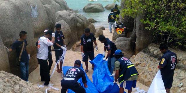 The body of slain British tourist, David Miller, wrapped in plastic sheet, is carried at a forensic police facility in Bangkok, Thailand, Tuesday, Sept. 16, 2014. Police on the scenic resort island of Koh Tao in southern Thailand conducted a sweep of hotels and workers' residences Tuesday searching for clues into the slayings of two British tourists whose nearly naked, battered bodies were found on a beach a day earlier.(AP Photo/Sakchai Lalit)