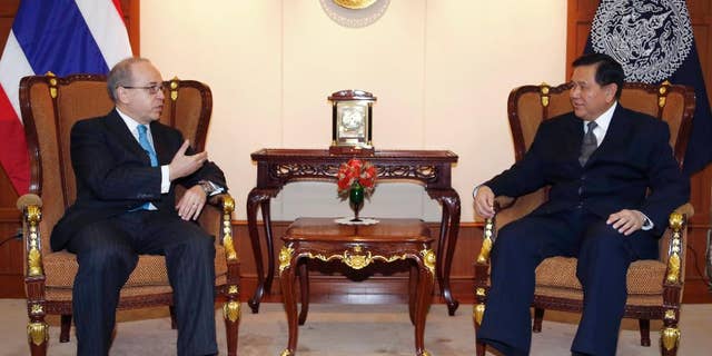 FILE - In this Monday, Jan. 26, 2015, file photo, U.S. Assistant Secretary of State for East Asian and Pacific Affairs Daniel Russel, left, talks to Thai Deputy Prime Minister and Foreign Minister Tanasak Patimapragorn during their meeting at the Foreign Ministry in Bangkok, Thailand. Russel's controversial speech to students at Chulalongkorn University on Monday has laid bare the delicate path Thailand’s leaders have been trying to navigate since toppling a democratically elected government in May, both by keeping a lid on dissent at home and by maintaining good relations with foreign allies abroad. (AP Photo/Sakchai Lalit, File)