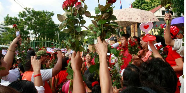 Sept. 17, 2010: Members of the United front for Democracy against Dictatorship (UDD), or Red Shirt, cheer to speech of a colleague during a rally outside a prison in Bangkok, Thailand.