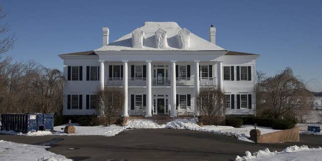 FILE - In this Wednesday, Feb. 11, 2015 photo shows the mansion called “Clairemont,” in New Hope, Pa. The family whose mansion burned three times in five years heads to court for a hearing to determine if they'll face trial in a $20 million insurance fraud case. The state attorney general's office has accused political fundraiser and hostess Claire Risoldi and her family of living large on trumped-up insurance claims. A grand jury report says the home in suburban Philadelphia has had three suspicious fires in five years. (AP Photo/Matt Rourke)