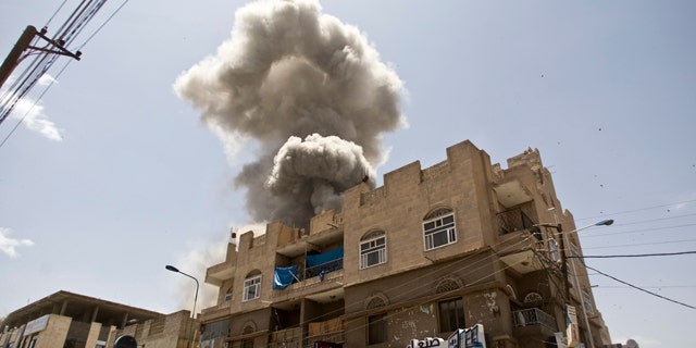 May 10, 2015: Smoke rises from a house of former Yemeni president Ali Abdullah Saleh after a Saudi-led airstrike in Sanaa, Yemen. (AP Photo/Hani Mohammed, File)