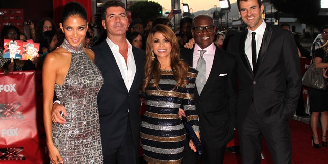 Sept. 14, 2011: Television show judges, Nicole Scherzinger, Simon Cowell, Paula Abdul, L.A. Reid, and show host Steve Jones arrive at the premiere Of Fox's 'The X Factor' held at ArcLight Cinemas Cinerama Dome Hollywood, Calif