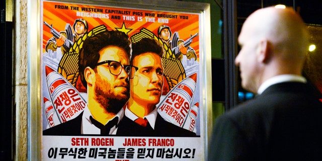 A security guard stands at the entrance of United Artists theater during the premiere of the film "The Interview" in Los Angeles, Dec.11.