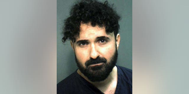 This arrest photo provided by the Orange County, Fla., Sheriff's Office, on Monday, Jan. 4, 2016, shows Frederick Torres. Torres, a recently fired caricature artist at Universal Orlando Resort, tried to kill his manager by stabbing him in the neck with scissors on New Year's Day at the Islands of Adventure park, according to a police report released Monday. (Orange County Sheriff's Office via AP)
