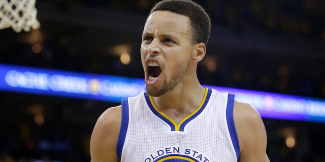 Golden State Warriors guard Stephen Curry (30) reacts after Shaun Livingston scored against the Oklahoma City Thunder during the second half of Game 7 of the NBA basketball Western Conference finals in Oakland, Calif., Monday, May 30, 2016. (AP Photo/Marcio Jose Sanchez)