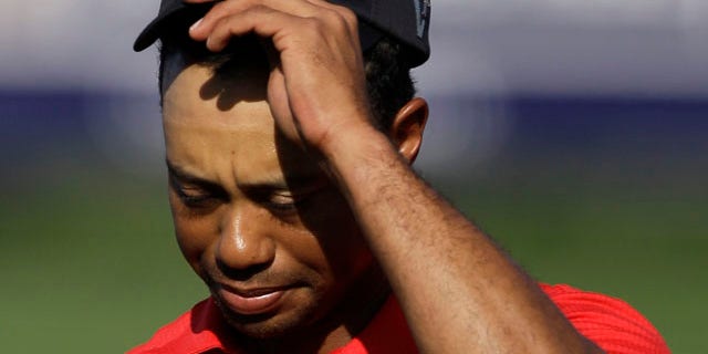 Feb. 13: Tiger Woods reacts after he finishes on the 18th hole during the final round of Dubai Desert Classic golf tournament at the Emirates Golf Club in Dubai, United Arab Emirates.