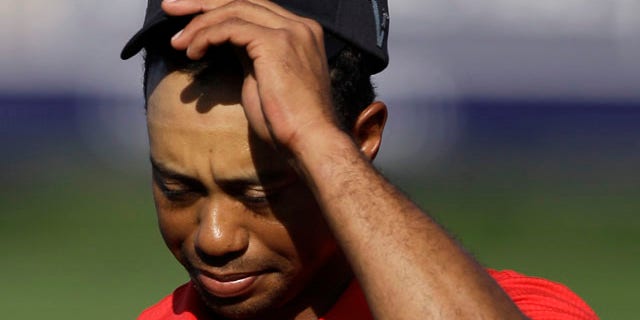 Feb. 13: Tiger Woods reacts after he finishes on the 18th hole during the final round of Dubai Desert Classic golf tournament at the Emirates Golf Club in Dubai, United Arab Emirates.