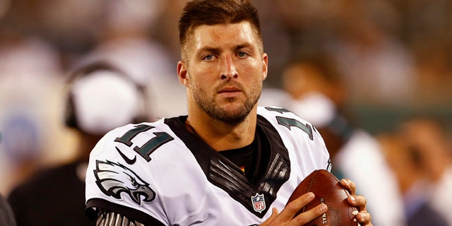 Quarterback Tim Tebow #11 of the Philadelphia Eagles warms up on the sidelines against the New York Jets in the third quarter during a pre-season game at MetLife Stadium on September 3, 2015 in East Rutherford, New Jersey. (Photo by Rich Schultz /Getty Images)