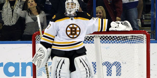 January 17, 2012: Boston Bruins goalie Tim Thomas reacts after giving up a goal to Tampa Bay Lightning center Dominic Moore during the third period of an NHL hockey game in Tampa, Fla.