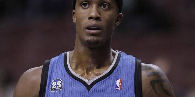 In this Oct. 23, 2013, photo, Minnesota Timberwolves' Dante Cunningham pauses during the Timberwolves' preseason NBA basketball game against the Philadelphia 76ers in Philadelphia. Police have arrested Cunningham for the second time in three days. Medina, Minn., police Officer Chris McGill says the 26-year-old Cunningham was arrested Sunday, April 6, 2014, on preliminary charges of making terrorist threats. He declined to go into detail about the allegations but said police would release more information about the arrest on Monday. (AP Photo/Laurence Kesterson)