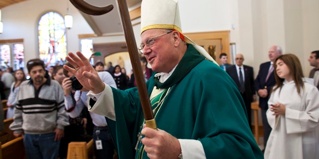 NEW YORK, NY - OCTOBER 27: Cardinal Timothy Dolan during a procession to celebrate a Mass of Remembrance marking the first anniversary of Hurricane Sandy at Our Lady Star of the Sea church on October 27, 2013 in Staten Island borough of New York City. Hurricane Sandy made landfall on October 29, 2012 near Brigantine, New Jersey and affected 24 states from Florida to Maine and cost the country an estimated $65 billion. (Photo by Ramin Talaie/Getty Images)