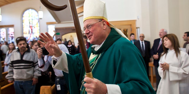 NEW YORK, NY - OCTOBER 27: Cardinal Timothy Dolan during a procession to celebrate a Mass of Remembrance marking the first anniversary of Hurricane Sandy at Our Lady Star of the Sea church on October 27, 2013 in Staten Island borough of New York City. Hurricane Sandy made landfall on October 29, 2012 near Brigantine, New Jersey and affected 24 states from Florida to Maine and cost the country an estimated $65 billion. (Photo by Ramin Talaie/Getty Images)