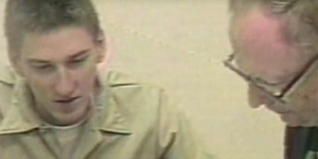 Timothy McVeigh (left) speaking with one of his defense attorneys.