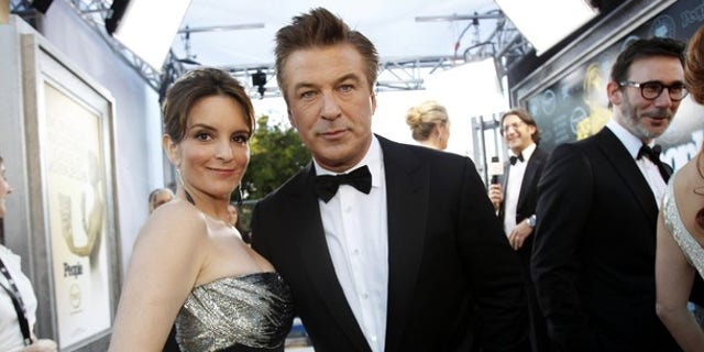 Actors Tina Fey (L) and Alec Baldwin, from the television series "30 Rock" at the Screen Actor's Guild Awards in January. The show will come to an end after its seventh season.