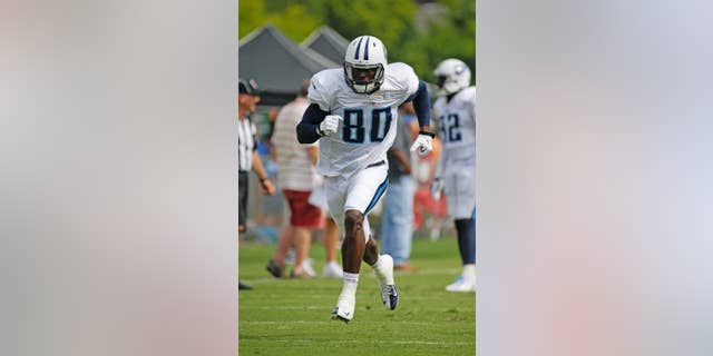 FILE - In this Aug. 1, 2014, file photo, Tennessee Titans wide receiver Derek Hagan runs a play during NFL football training camp in Nashville, Tenn. Hagan sat around all last season hoping for a phone call from an NFL team. Now he's in training camp with the Titans hoping to earn a roster spot keeping him around the league for another season. (AP Photo/Mark Humphrey, File)