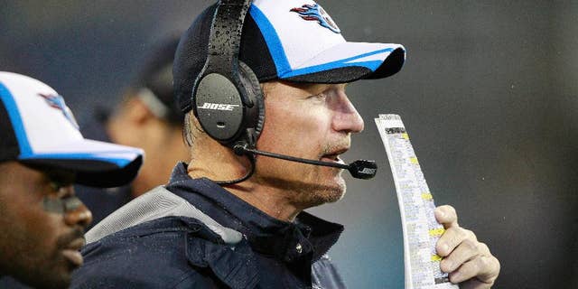 FILE - In this Aug. 9, 2014, file photo, Tennessee Titans head coach Ken Whisenhunt watches the action during his first game as the Titans' head coach against the Green Bay Packers in a preseason NFL football game in Nashville, Tenn. Whisenhunt has been a much needed breath of fresh air for the Titans, snapping them out of routines and holding them accountable for mistakes. (AP Photo/Wade Payne, File)