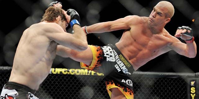 LAS VEGAS - NOVEMBER 21: Tito Ortiz (R) battles Forrest Griffin (L) during their Light Heavyweight Fight at the UFC 106 at Mandalay Bay Events Center on November 21, 2009 in Las Vegas, Nevada. (Photo by Jon Kopaloff/Getty Images)
